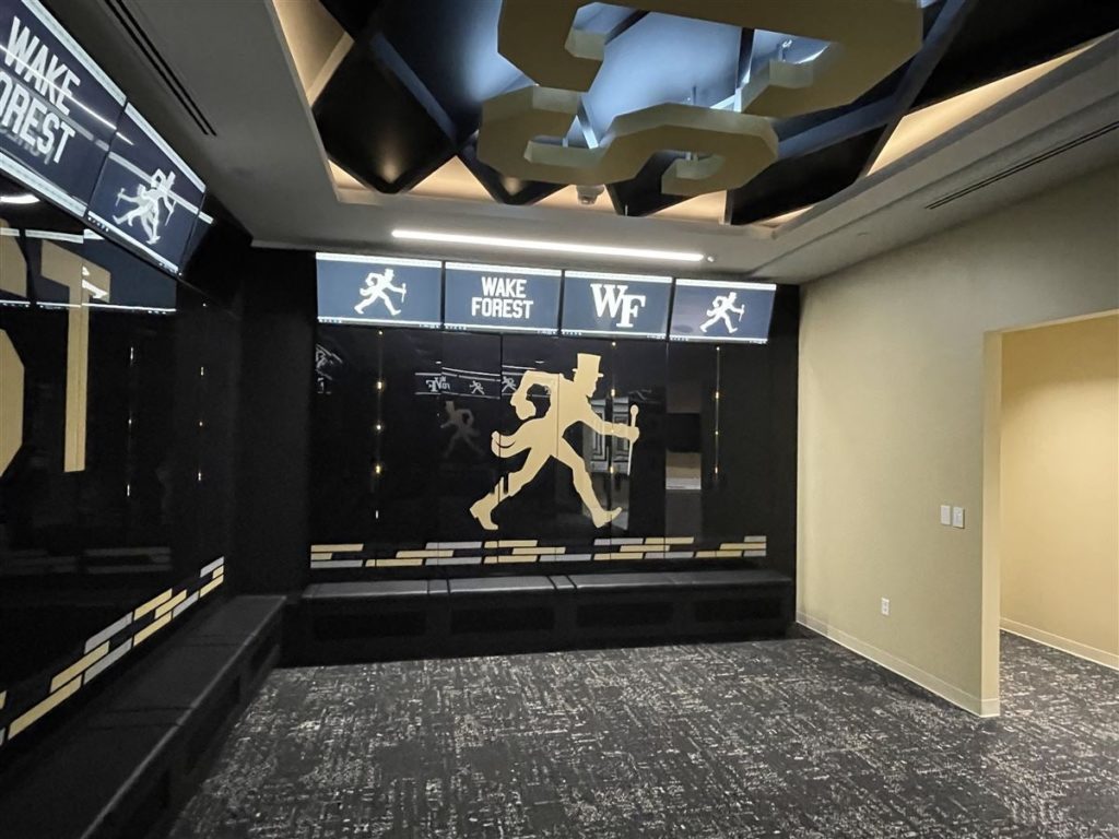 Elevate Your Game with a Black and Gold Basketball Locker Room Makeover